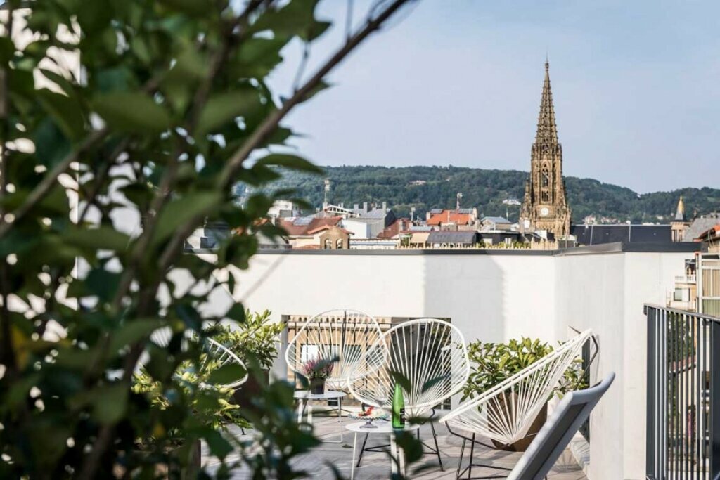 Relax on the rooftop with views of the surrounding hills (photo courtesy of Hotel Villa Victoria by Intur)