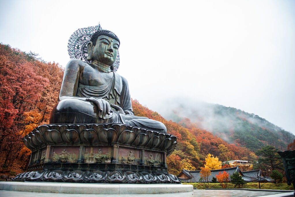 Discover South Korea's history on an epic tour of the country and see sights like the big Buddha monument of Sinheungsa Temple in Sokcho