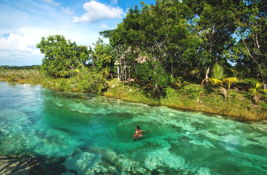 Enjoy swims in cenotes, the Caribbean Sea, and Lake Bacalar during this active road trip
