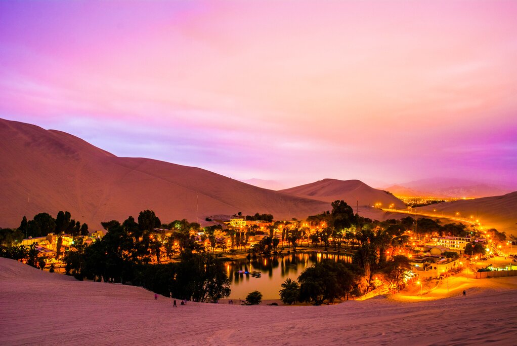 Spend your last night of the trip in Huacachina, a desert village surrounded by sand dunes