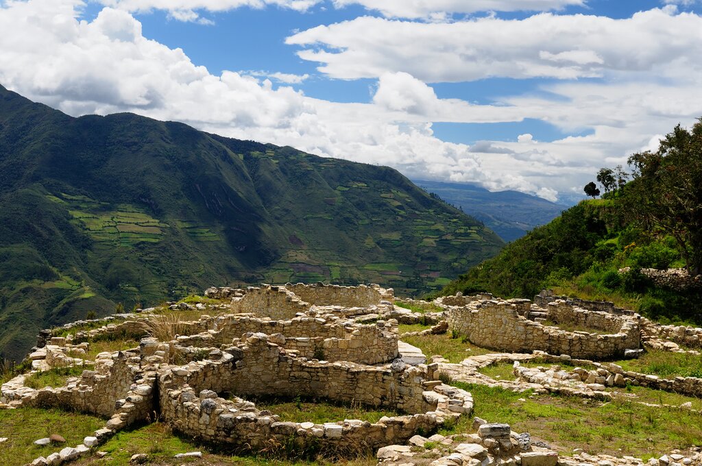 Panoramic view of circular structures at Kuélap