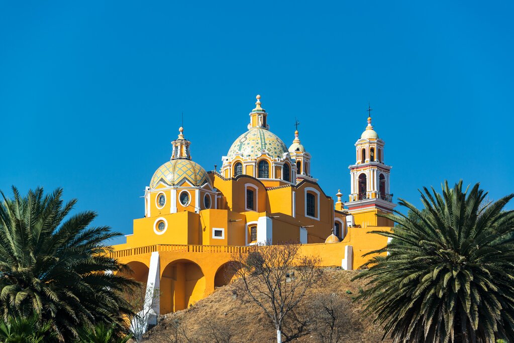 Visit Nuestra Señora de los Remedios Church perched atop Tlachihualtepetl (the Great Pyramid of Cholula)
