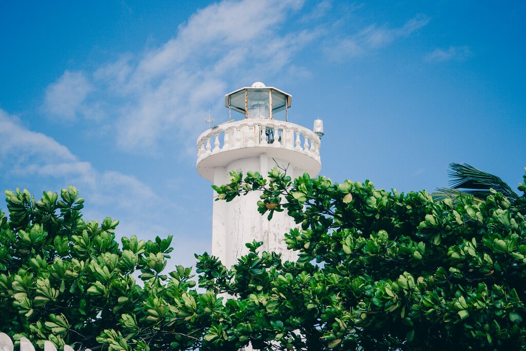 A lighthouse keeps watch over the rich biodiversity and coral gardens off the shores of Puerto Morelos