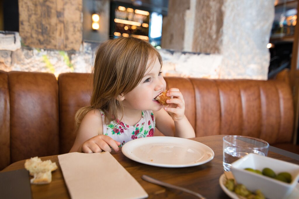 A child enjoying tapas in Spain