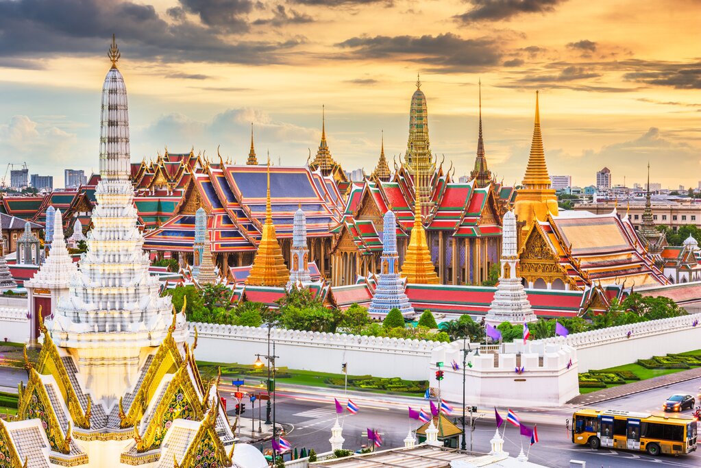 Aerial photo of Bangkok with the Grand Palace (center) and Wat Phra Kaew (left) at sunset