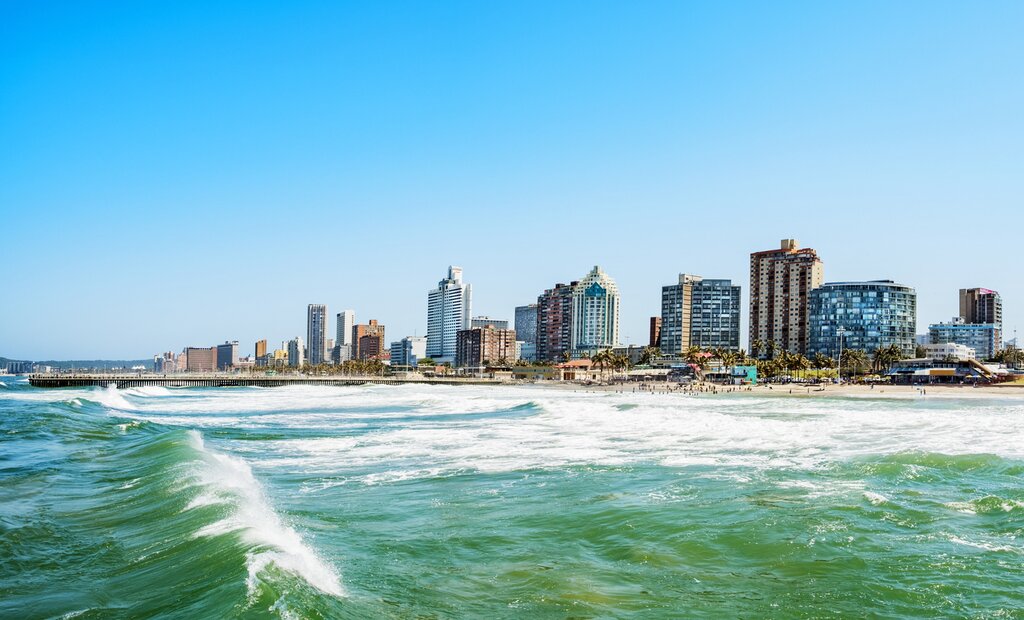 A view of Durban Beach from the water with a wave rolling past the viewer