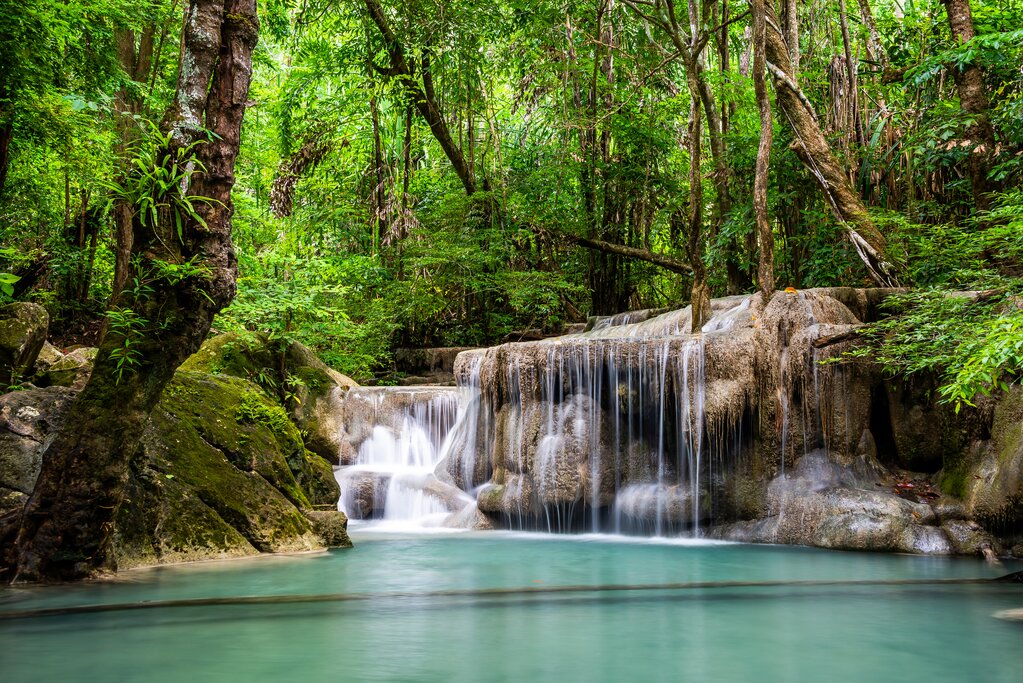 Take a dip in the turquoise pool of the Erawan waterfall