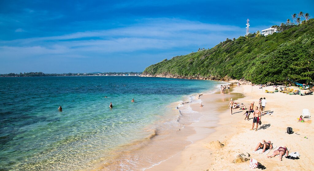 Soak up some sun on Unawatuna's palm-lined beaches