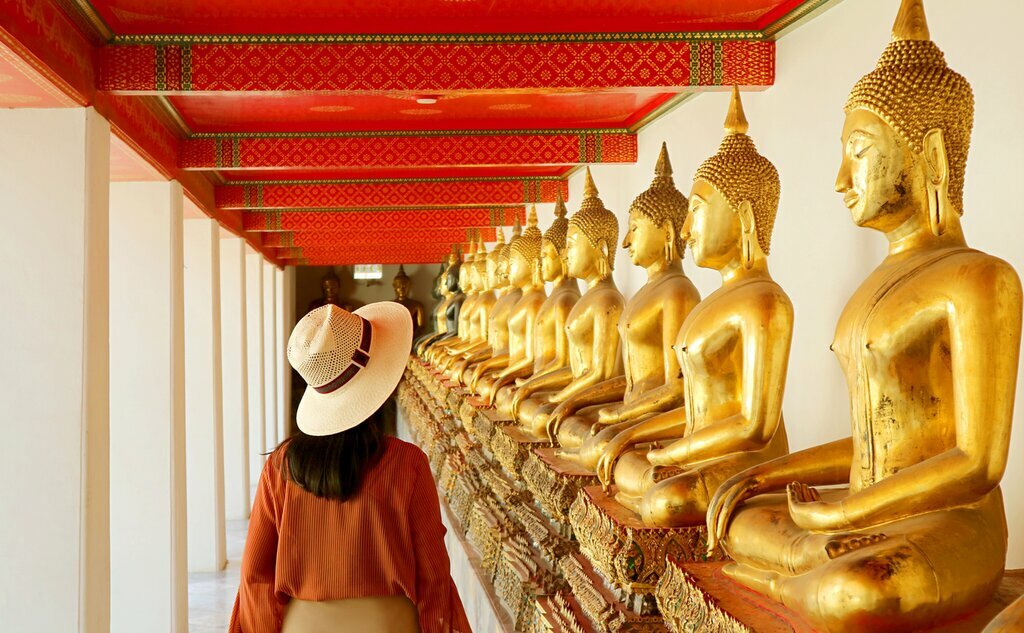 Explore dynamic Bangkok's busy streets and sacred temples