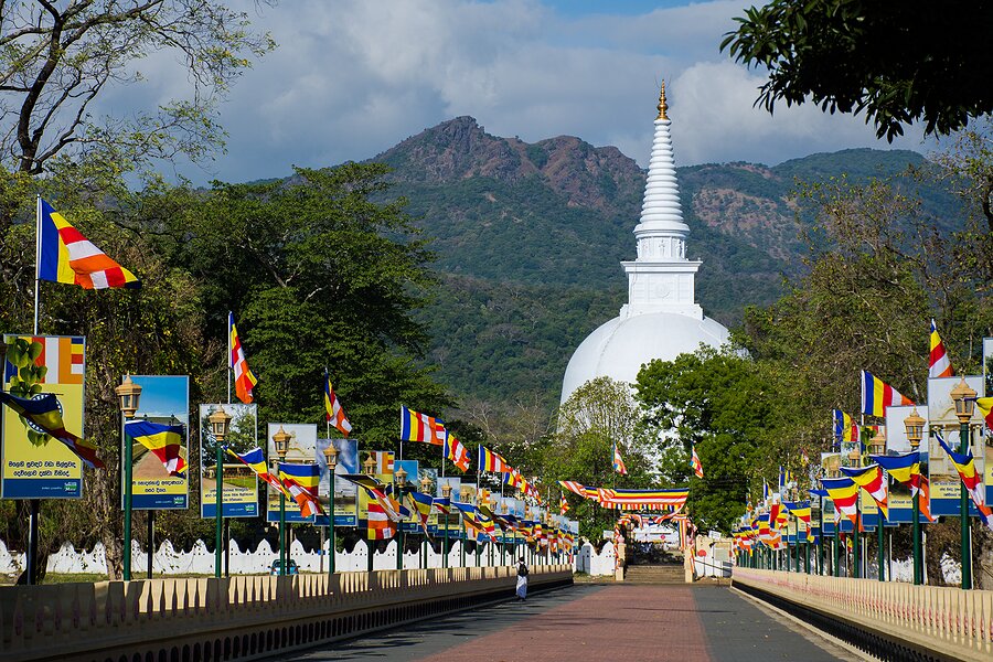 Colorful flags lining the entrance to Mahiyangana's Raja Maha Vihara Temple