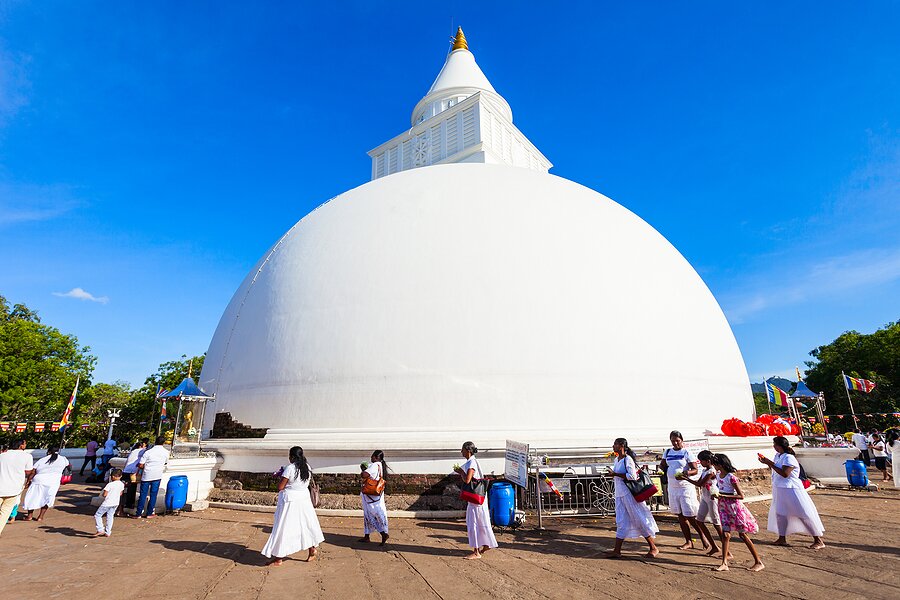 Pilgrims at Kataragama's Buddhist stupa (shrine) of Kiri Vehera