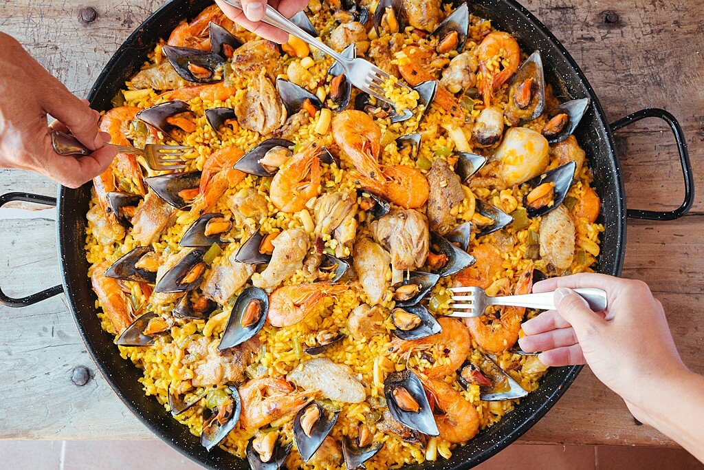 Enjoy an interactive, hands-on paella cooking class