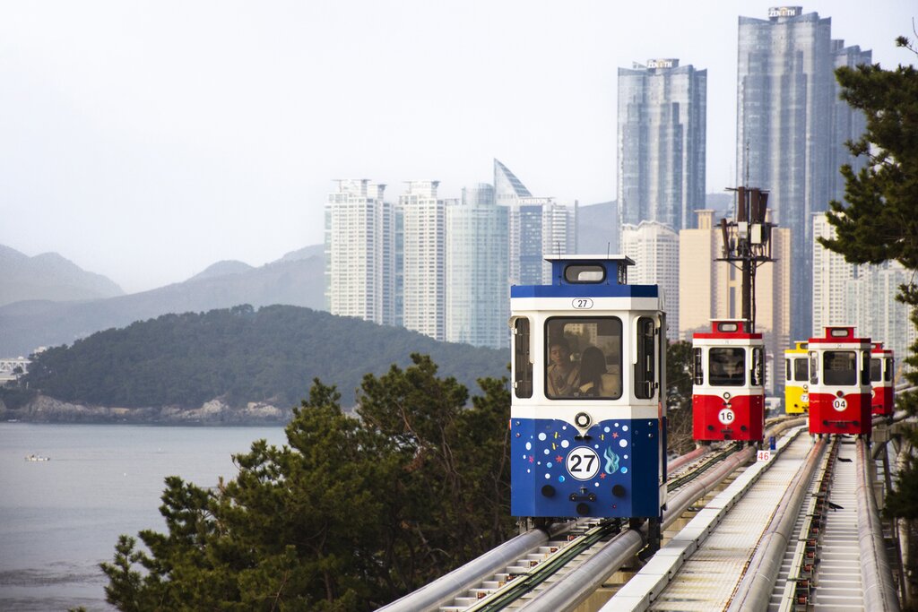 Go for a ride in a Sky Capsule tram at the Haeundae Blue Line Park in Busan