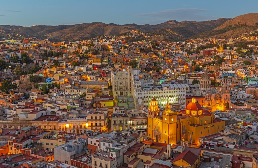 Guanajuato city during the blue hour with the famous orange Basilica of Our Lady of Guanajuato, Mexico.