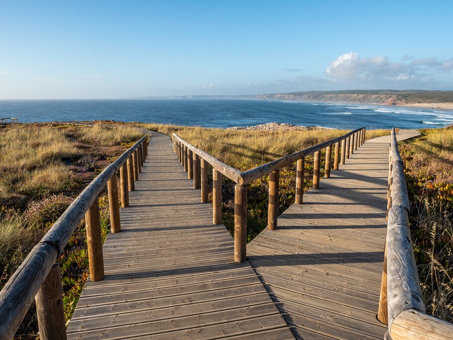 Boardwalk trails near Bordeira lead off into the evening sunshine (photo courtesy of mountaintreks)