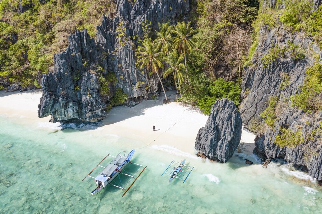 Lay on the white sands of Palawan's many beaches