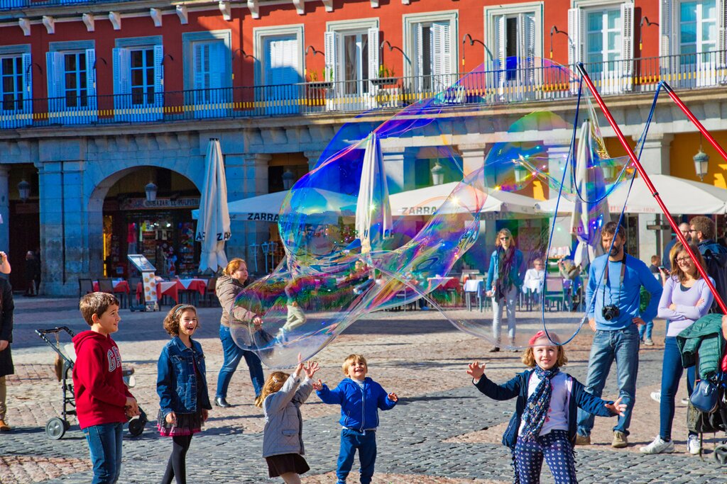Children playing in Madrid's Plaza Mayor