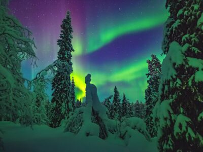 Beautiful Northern lights over the head in Lapland