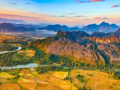 Aerial view of the fields, river and mountain. Beautiful landsca